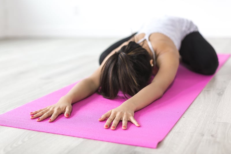 Woman practicing Yin Yoga